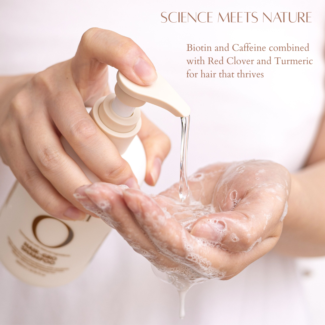 Hand pouring Olivii shampoo from a bottle into hand